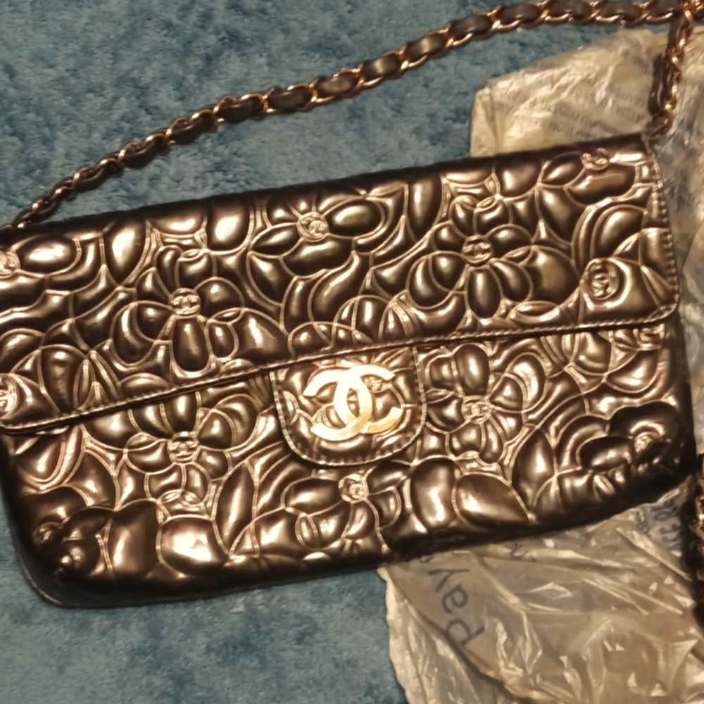 Black Chanel classic purse with gold logo clasp